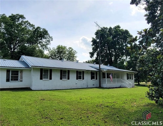 75 Gunnell Rd, Comer, GA 30629 - view of front facade featuring a front lawn, metal roof, a porch, and stucco siding