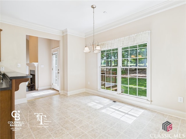 1090 Lane Creek Cir, Bishop, GA 30677 - unfurnished dining area featuring crown molding, a chandelier, light tile patterned floors, baseboards, and a fireplace