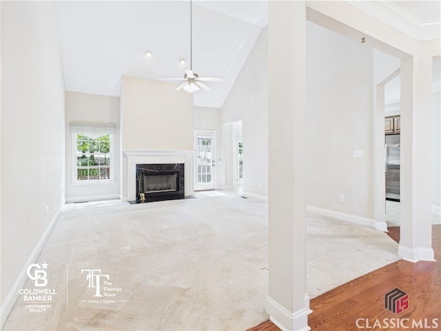 1090 Lane Creek Cir, Bishop, GA 30677 - unfurnished living room featuring a ceiling fan, a high end fireplace, baseboards, high vaulted ceiling, and carpet flooring