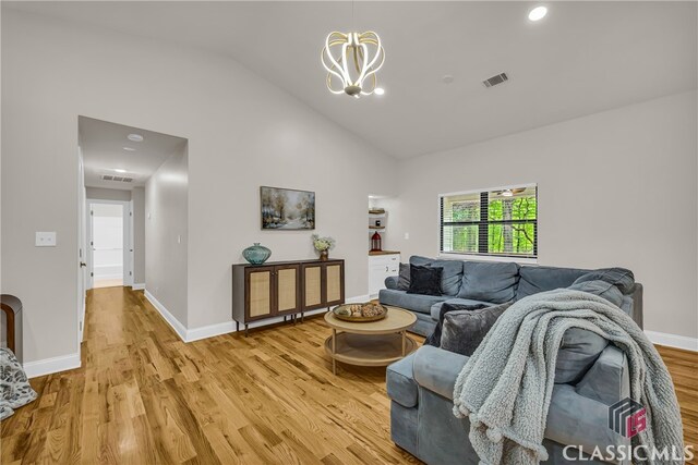 3920 Old Lexington Rd, Athens, GA 30605 - living area featuring light wood-style flooring, a chandelier, lofted ceiling, baseboards, and recessed lighting