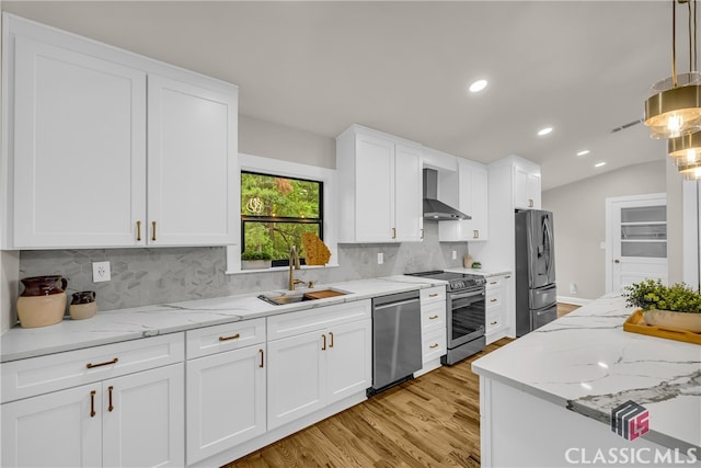 3920 Old Lexington Rd, Athens, GA 30605 - kitchen featuring stainless steel appliances, a sink, wall chimney range hood, light wood-style floors, and recessed lighting