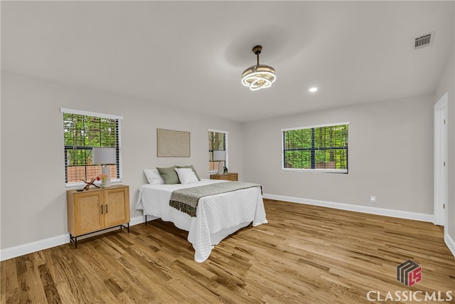 3920 Old Lexington Rd, Athens, GA 30605 - bedroom featuring light wood-style floors, multiple windows, baseboards, and recessed lighting