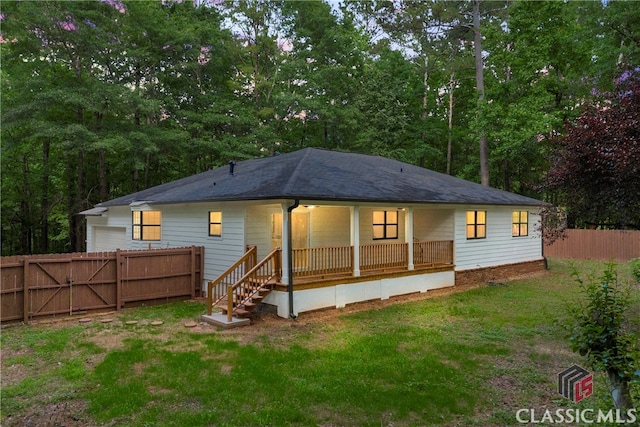 3920 Old Lexington Rd, Athens, GA 30605 - back of house with a porch, a garage, and a gate