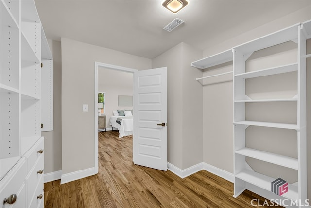 3920 Old Lexington Rd, Athens, GA 30605 - walk in closet featuring wood finished floors