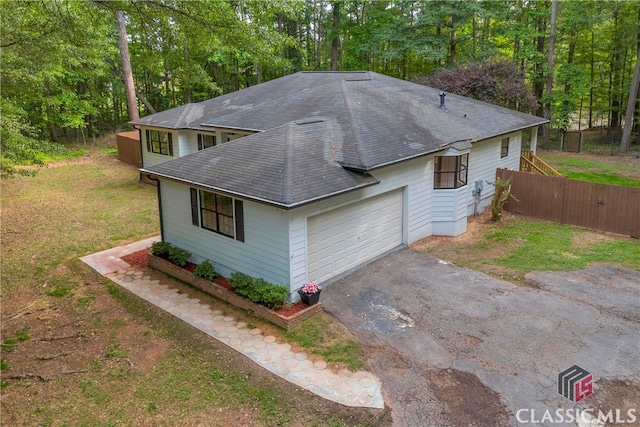 3920 Old Lexington Rd, Athens, GA 30605 - view of front of property with roof with shingles, an attached garage, and asphalt driveway