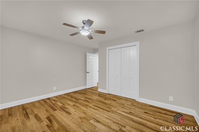 3920 Old Lexington Rd, Athens, GA 30605 - unfurnished bedroom with baseboards, light wood-style floors, a closet, and ceiling fan