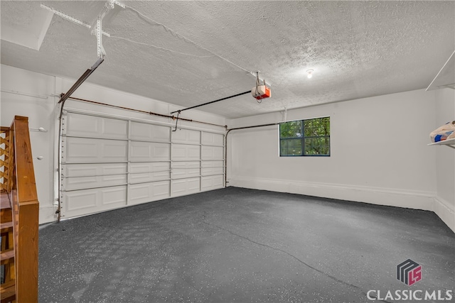 3920 Old Lexington Rd, Athens, GA 30605 - garage with a garage door opener and baseboards