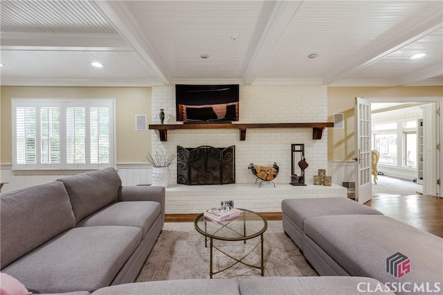 155 Wexford Pl, Athens, GA 30609 - living area featuring wood finished floors, beam ceiling, a brick fireplace, crown molding, and wainscoting