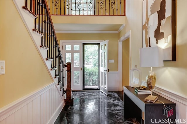 155 Wexford Pl, Athens, GA 30609 - entrance foyer with wainscoting, stairway, a decorative wall, and crown molding