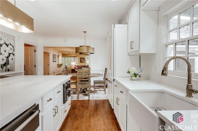 155 Wexford Pl, Athens, GA 30609 - kitchen featuring a sink, a warming drawer, dark wood-style floors, built in microwave, and light countertops
