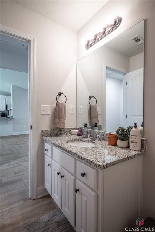 35 Westwood St, Danielsville, GA 30633 - bathroom with wood finished floors, vanity, and baseboards