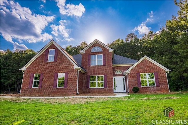 4085 Fawn Vly, Loganville, GA 30052 - traditional home with brick siding and a front yard
