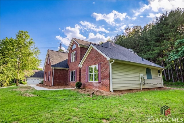 4085 Fawn Vly, Loganville, GA 30052 - view of side of home with brick siding, a yard, and roof with shingles
