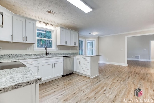 4085 Fawn Vly, Loganville, GA 30052 - kitchen with dishwasher, crown molding, a peninsula, a sink, and light wood-style floors