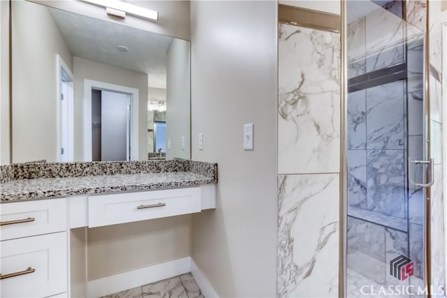 4085 Fawn Vly, Loganville, GA 30052 - bathroom with marble finish floors, a marble finish shower, vanity, and baseboards