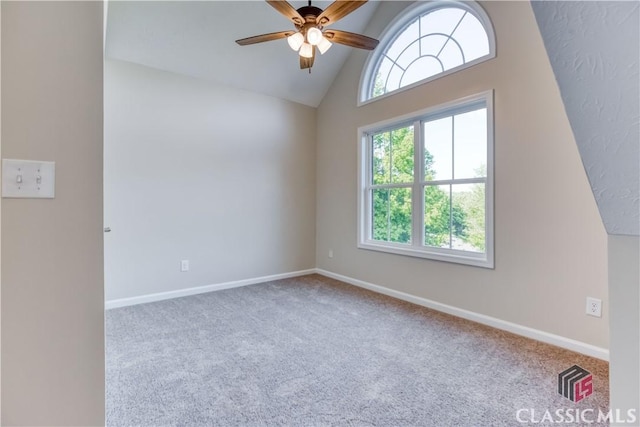 4085 Fawn Vly, Loganville, GA 30052 - carpeted empty room with ceiling fan, baseboards, and high vaulted ceiling