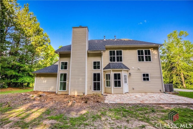 4085 Fawn Vly, Loganville, GA 30052 - rear view of house with a patio, a chimney, and cooling unit
