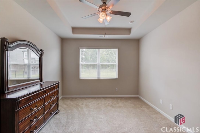 334 Pepin Ct, Hoschton, GA 30548 - unfurnished room with a tray ceiling, light colored carpet, ceiling fan, and baseboards