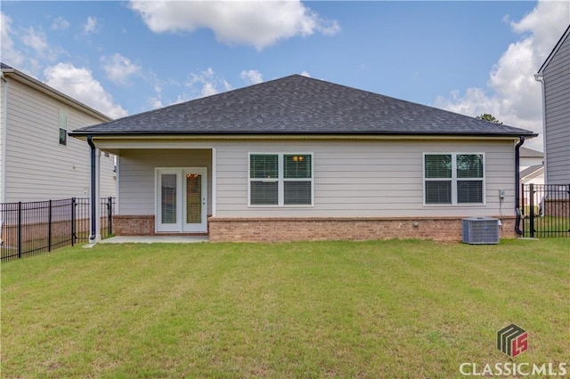 334 Pepin Ct, Hoschton, GA 30548 - rear view of house with a shingled roof, brick siding, and central air condition unit