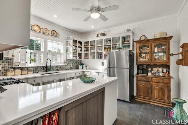 99 Hickory St, Commerce, GA 30529 - kitchen featuring freestanding refrigerator, open shelves, a sink, tasteful backsplash, and a ceiling fan