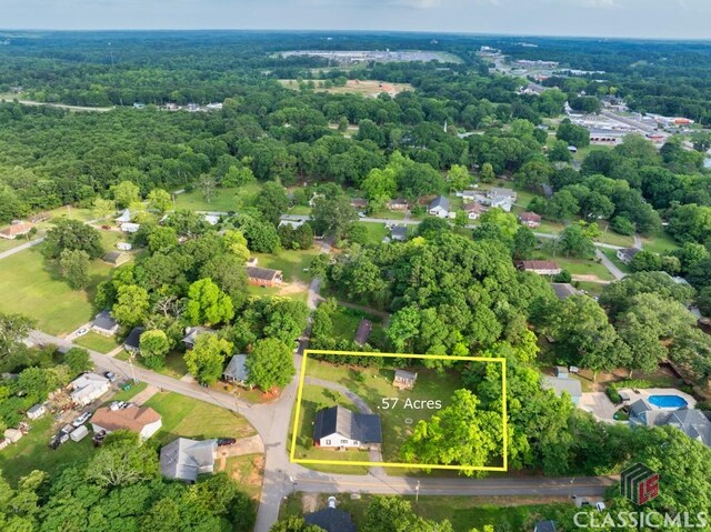 99 Hickory St, Commerce, GA 30529 - aerial view of property and surrounding area with a forest and property boundaries highlighted