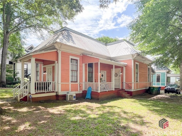 485 Meigs St, Athens, GA 30601 - view of front of house featuring covered porch, a front lawn, ac unit, and metal roof