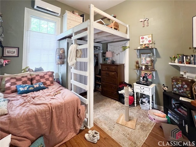 485 Meigs St, Athens, GA 30601 - bedroom featuring a wall mounted air conditioner and wood finished floors