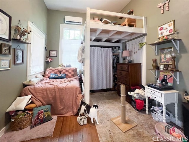 485 Meigs St, Athens, GA 30601 - bedroom featuring an AC wall unit, hardwood / wood-style flooring, and beam ceiling