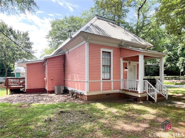 485 Meigs St, Athens, GA 30601 - view of side of home featuring crawl space, a lawn, metal roof, and central AC