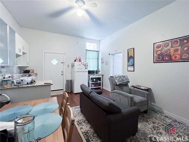 485 Meigs St, Athens, GA 30601 - living room featuring dark wood-style flooring, a ceiling fan, and baseboards