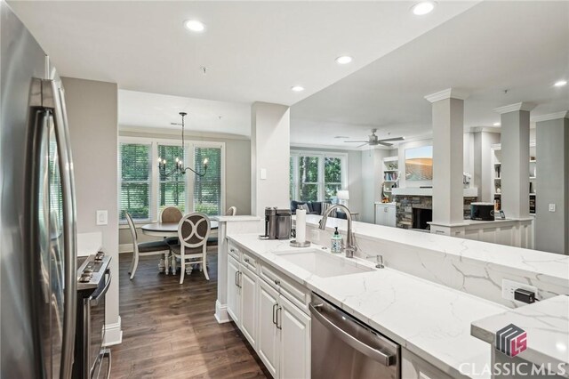 1050 Tailwater Unit A, Greensboro, GA 30642 - kitchen with appliances with stainless steel finishes, a sink, a ceiling fan, a chandelier, and recessed lighting