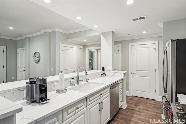 1050 Tailwater Unit A, Greensboro, GA 30642 - kitchen featuring a sink, appliances with stainless steel finishes, dark wood-style flooring, light stone counters, and ornamental molding