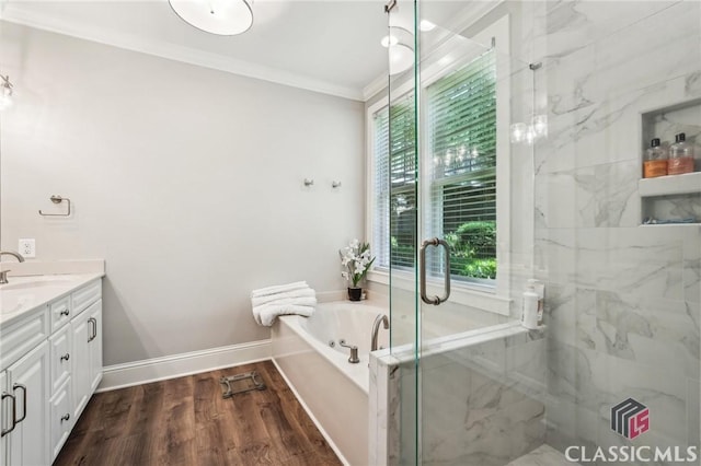 1050 Tailwater Unit A, Greensboro, GA 30642 - bathroom featuring crown molding, vanity, a bath, a marble finish shower, and wood finished floors