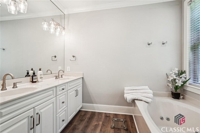 1050 Tailwater Unit A, Greensboro, GA 30642 - full bathroom featuring double vanity, a tub with jets, crown molding, and wood finished floors