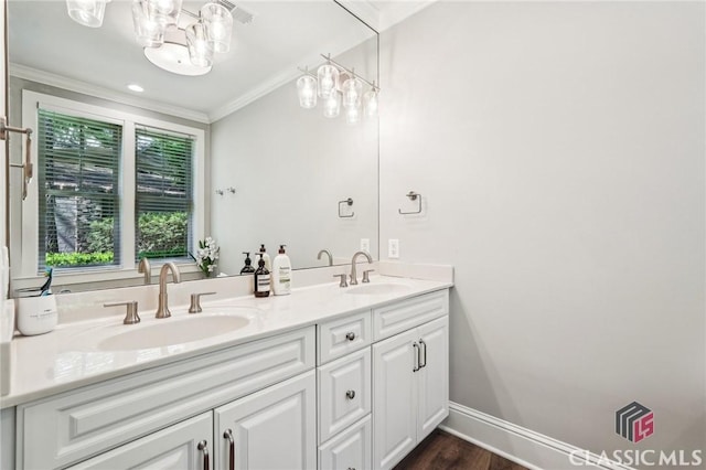 1050 Tailwater Unit A, Greensboro, GA 30642 - full bathroom featuring ornamental molding, a chandelier, double vanity, baseboards, and wood finished floors