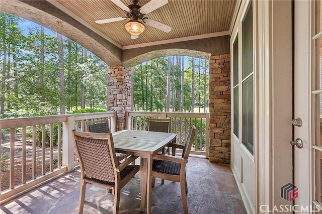 1050 Tailwater Unit A, Greensboro, GA 30642 - view of patio featuring ceiling fan, outdoor dining area, and view of wooded area