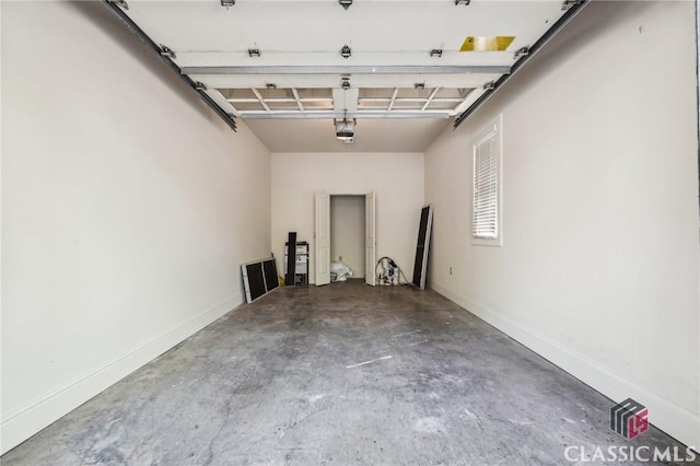 1050 Tailwater Unit A, Greensboro, GA 30642 - garage with a garage door opener and baseboards