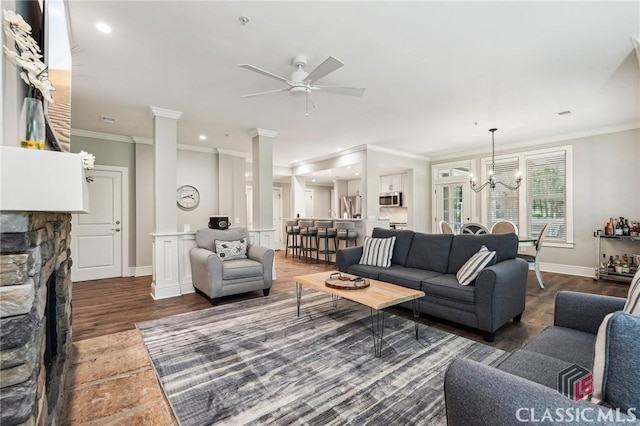 1050 Tailwater Unit A, Greensboro, GA 30642 - living area featuring ornamental molding, a ceiling fan, a chandelier, baseboards, and wood finished floors