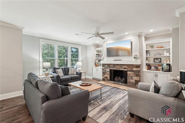 1050 Tailwater Unit A, Greensboro, GA 30642 - living area with baseboards, a ceiling fan, crown molding, dark wood-type flooring, and a stone fireplace