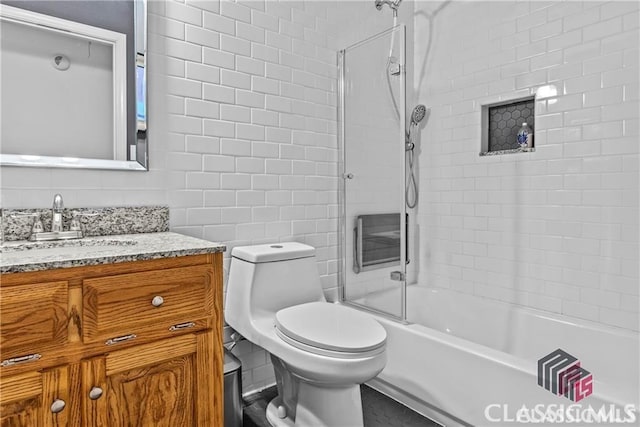 1061 Calls Creek Dr, Watkinsville, GA 30677 - full bath with vanity, washtub / shower combination, toilet, and tile walls