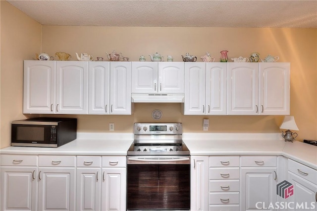 224 Red Oak Dr, Maysville, GA 30558 - kitchen featuring appliances with stainless steel finishes, under cabinet range hood, white cabinetry, and light countertops