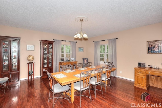 224 Red Oak Dr, Maysville, GA 30558 - dining room featuring a chandelier, wood finished floors, plenty of natural light, baseboards, and a textured ceiling