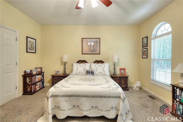 224 Red Oak Dr, Maysville, GA 30558 - carpeted bedroom with baseboards, a ceiling fan, and a textured ceiling
