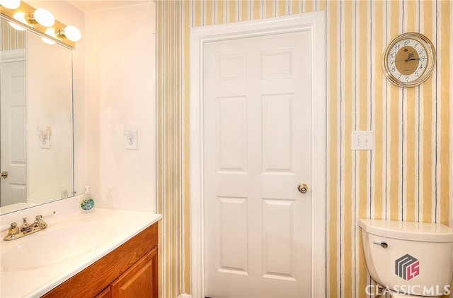 224 Red Oak Dr, Maysville, GA 30558 - bathroom with wallpapered walls, vanity, and toilet