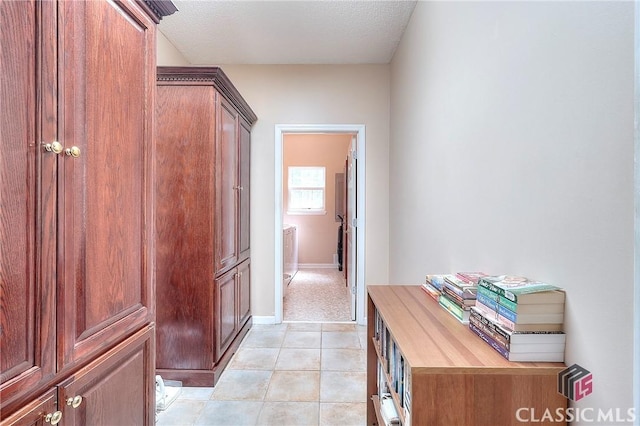 224 Red Oak Dr, Maysville, GA 30558 - corridor with light tile patterned floors, washer / clothes dryer, and baseboards
