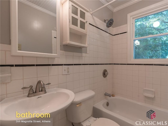 269 Magnolia St, Athens, GA 30606 - full bathroom with a sink, toilet, ornamental molding, tile walls, and shower / bathtub combination