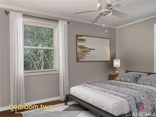 269 Magnolia St, Athens, GA 30606 - bedroom featuring baseboards, multiple windows, wood finished floors, ornamental molding, and a ceiling fan