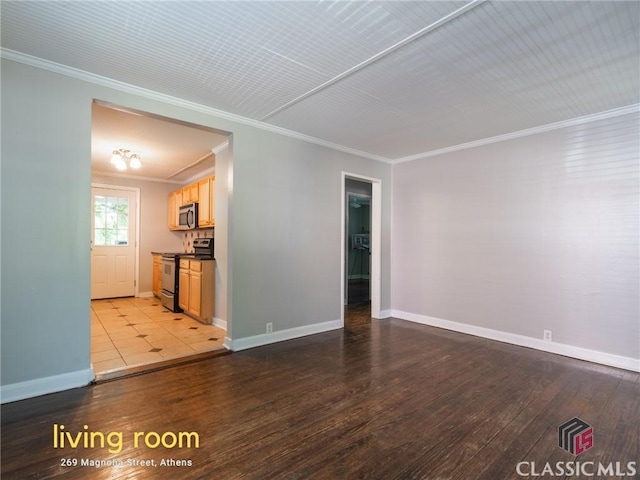 269 Magnolia St, Athens, GA 30606 - unfurnished living room featuring ornamental molding, wood finished floors, and baseboards