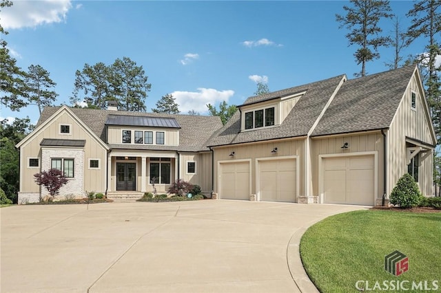 1170 Broadpoint Dr, Greensboro, GA 30642 - view of front of home featuring concrete driveway, a garage, french doors, roof with shingles, and board and batten siding