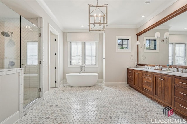 1170 Broadpoint Dr, Greensboro, GA 30642 - full bath featuring double vanity, a stall shower, a freestanding bath, crown molding, and a chandelier
